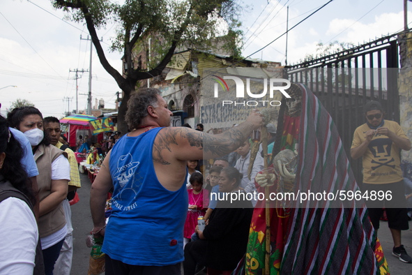 On the first day of each month, believers in Santa Muerte gather at Calle de Alfarería # 12 in the brave neighborhood of Tepito in CDMX, thi...