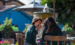 People enjoy a sunny day eating lunch at el Chorro de Quevedo as part of the pilot to re o...
