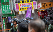 Hong Kong Police raise the purple flag that indicates that the gathering may be in breach...