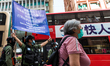 Police raise the blue flag warning of unlawful assembly on Nathan road, In Hong Kong, Chin...