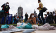 A woman dressed as a mermaid demonstrates amid members of climate change activist movement...