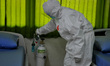 Medical officers inspect the emergency isolation room at the Patriot Candrabhaga stadium w...