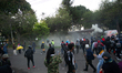 Demonstrators clash with riot police during a protest against the death of a lawyer under...