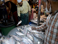 Bangladeshi vendors sell Hilsa fish at the Karwan Bazar wholesale fish market in Dhaka, Bangladesh, on September 10, 2020 (
