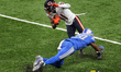 Chicago Bears wide receiver Darnell Mooney (11) is sacked by Detroit Lions cornerback Aman...