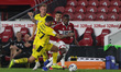Alex Mowatt of Barnsley in action with Middlesbrough's Marc Bola  during the Carabao Cup m...