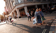 Shoppers cross a junction in front of a branch of clothing and food retailer Marks and Spe...