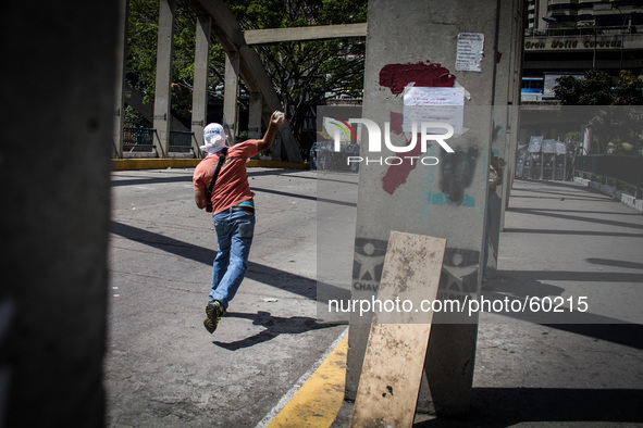 Venezuelan students protest against the government of President Nicolas Maduro in Caracas resulted with police intervention on March 20, 201...