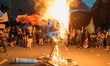 Activists burn an effigy of President Rodrigo Duterte during the 48th anniversary of Marti...