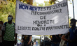 The banner reads 'No to bones test'. A collective, AutonoMIE, called for a gathering in To...