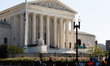 People gather outside the Supreme Court to pay respects as Justice Ruth Bader Ginsburg lie...