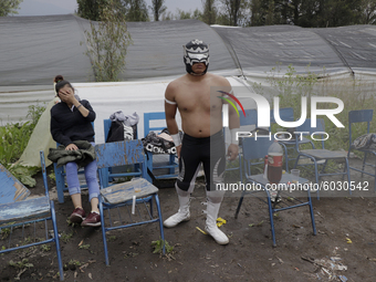 Rey Optimus, a member of Chinampaluchas, during a wrestling function in chinampa of Lake Xochimilco during the health emergency due to COVID...