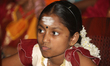 Tamil girl waits to perform in a special cultural program featuring Tamil children who wer...