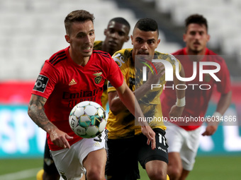Alejandro Grimaldo of SL Benfica (L) vies with Lucas Rodrigues of Moreirense FC during the Portuguese League football match between SL Benfi...