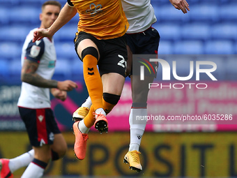   Newports Ryan Taylor clashes with Boltons Liam Gordon during the Sky Bet League 2 match between Bolton Wanderers and Newport County at the...