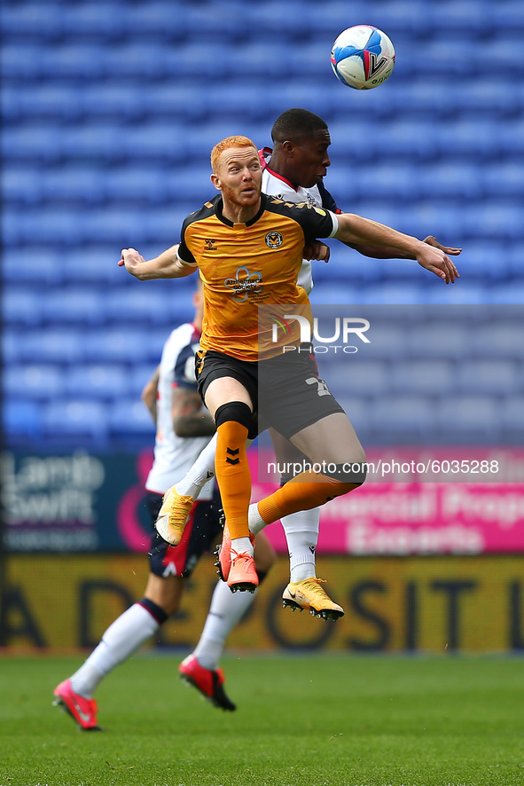  Newports Ryan Taylor clashes with Boltons Liam Gordon  during the Sky Bet League 2 match between Bolton Wanderers and Newport County at the...
