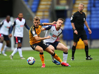    Newports Scott Twine battles with BoltonsTom White  during the Sky Bet League 2 match between Bolton Wanderers and Newport County at the...