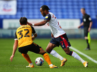   Boltons Nathan Delfounesco gets passed Newports Liam Shephard during the Sky Bet League 2 match between Bolton Wanderers and Newport Count...