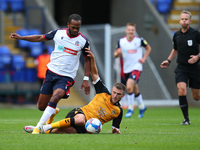  Nathan Delfounesco battles with Newports Ryan Taylor  during the Sky Bet League 2 match between Bolton Wanderers and Newport County at the...