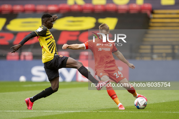   Rhys Norrington-Davies of Luton Town and Ismaila Sarr of Watford during the Sky Bet Championship match between Watford and Luton Town at V...