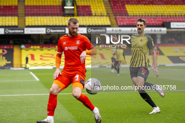   Ryan Tunnicliffe of Luton Town and Craig Cathcart of Watford during the Sky Bet Championship match between Watford and Luton Town at Vicar...