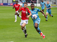  
Ian Henderson of Salford City FC tangles with Jayden Richardson of Forest Green Rovers  during the Sky Bet League 2 match between Salford...