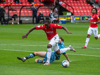  
 Liam Kitching of Forest Green Rovers tackles Tom Elliott of Salford City FC during the Sky Bet League 2 match between Salford City and Fo...
