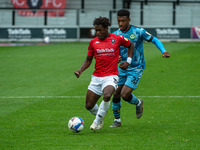  
Brandon Thomas-Asante of Salford City FC is tackled by Jayden Richardson of Forest Green Rovers  during the Sky Bet League 2 match between...