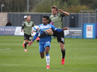    Tom Eastman of Colchester United in action with Barrow's Dior Angus during the Sky Bet League 2 match between Barrow and Colchester Unite...