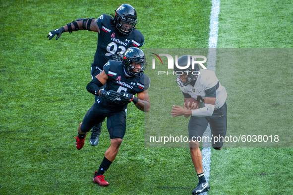 Army quarterback Christian Anderson (4) runs the ball upfield during an NCAA college football game at Nippert Stadium between the University...