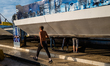 Workers work on the installation of a carousel in the Luna Park in Molfetta on October 2nd...