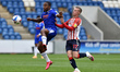   Colchester United's Callum Harriott and Oldham Athletic's Jordan Barnett during the Sky...