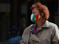 A lady wearing a protective mask seen walking in Vitosha Boulevard, the main commercial street in the centre of Sofia. 
The number of people...