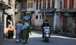Kashmiri man wearing a mask rides a scooter amid COVID-19 (Coronavirus) Pandemic in Sopore...