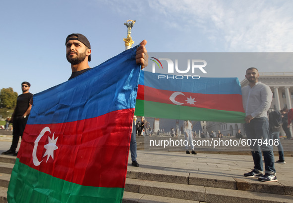 Azerbaijanis who live in Ukraine hold Azerbaijan's flag during their rally in support Azerbaijan against Armenia in the Nagorno-Karabakh con...