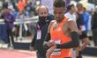 Youssef Sbaai of Morocco seen checking his watch after crossing the finish line in 02:13:0...