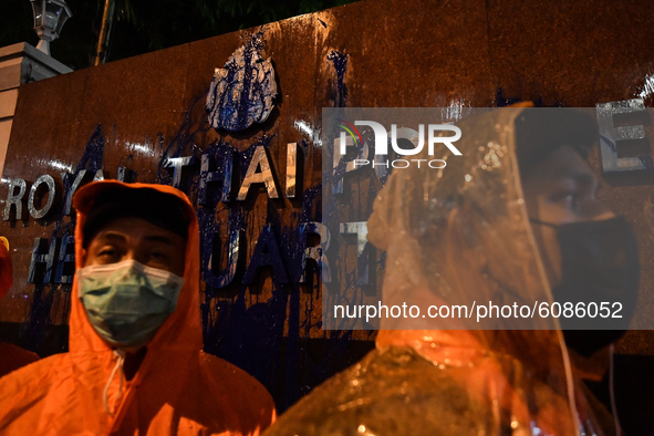 Royal Thai Police banner was splashed blue paint by protesters to protest the earlier arrest of protesters rally at Democracy Monument on Oc...