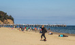 People enjoying last warm days of summer walking, jogging and resting at the Baltic Sea co...