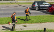 Worker mowing grass with a brush cutter, lawn mower is seen in Gdynia, Poland, on 17 Septe...