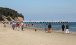 People enjoying last warm days of summer walking, jogging and resting at the Baltic Sea co...