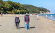 People enjoying last warm days of summer walking, jogging and resting at the Baltic Sea co...