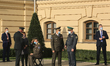 Ukrainian military officials talk to each other around  the Head of the Ivan Bohun Kyiv Mi...