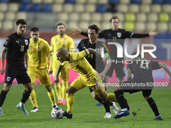 Ionut Mitrita of Romania in action against Stefan Ilsanker of Austria of UEFA Nations League football match in Ploiesti city October 14, 202...
