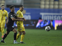 Alessandro Schöpf of Austria in action against Nicolae Stanciu of Romania of Romania during the UEFA Nations League match between Romania v...