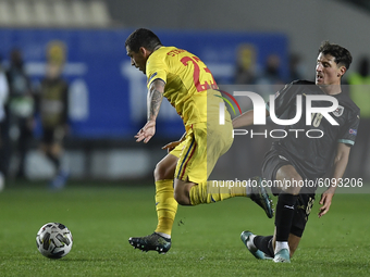 Alessandro Schöpf of Austria in action against Nicolae Stanciu of Romania during the UEFA Nations League match between Romania v Austria, in...