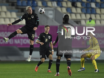 Xaver Schlager of Austria in action against Razvan Marin of Romania  during the UEFA Nations League match between Romania v Austria, in Ploi...