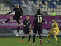 Xaver Schlager of Austria in action against Razvan Marin of Romania  during the UEFA Nations League match between Romania v Austria, in Ploi...