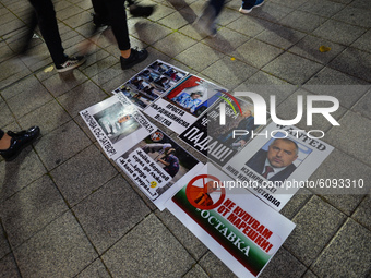 People walk by posters related to Prime Minister Boyko Borissov left on the street in Burgas city center.
Bulgarians have been demonstrating...