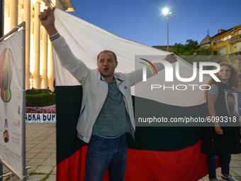 Protesters with a Bulgarian national flag seen in Burgas city center.
Bulgarians have been demonstrating in Sofia and around the country for...