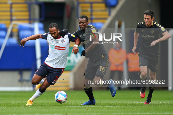  Boltons Nathan Delfouneso battles with Oldhams Brice Ntambwe during the Sky Bet League 2 match between Bolton Wanderers and Oldham Athletic...